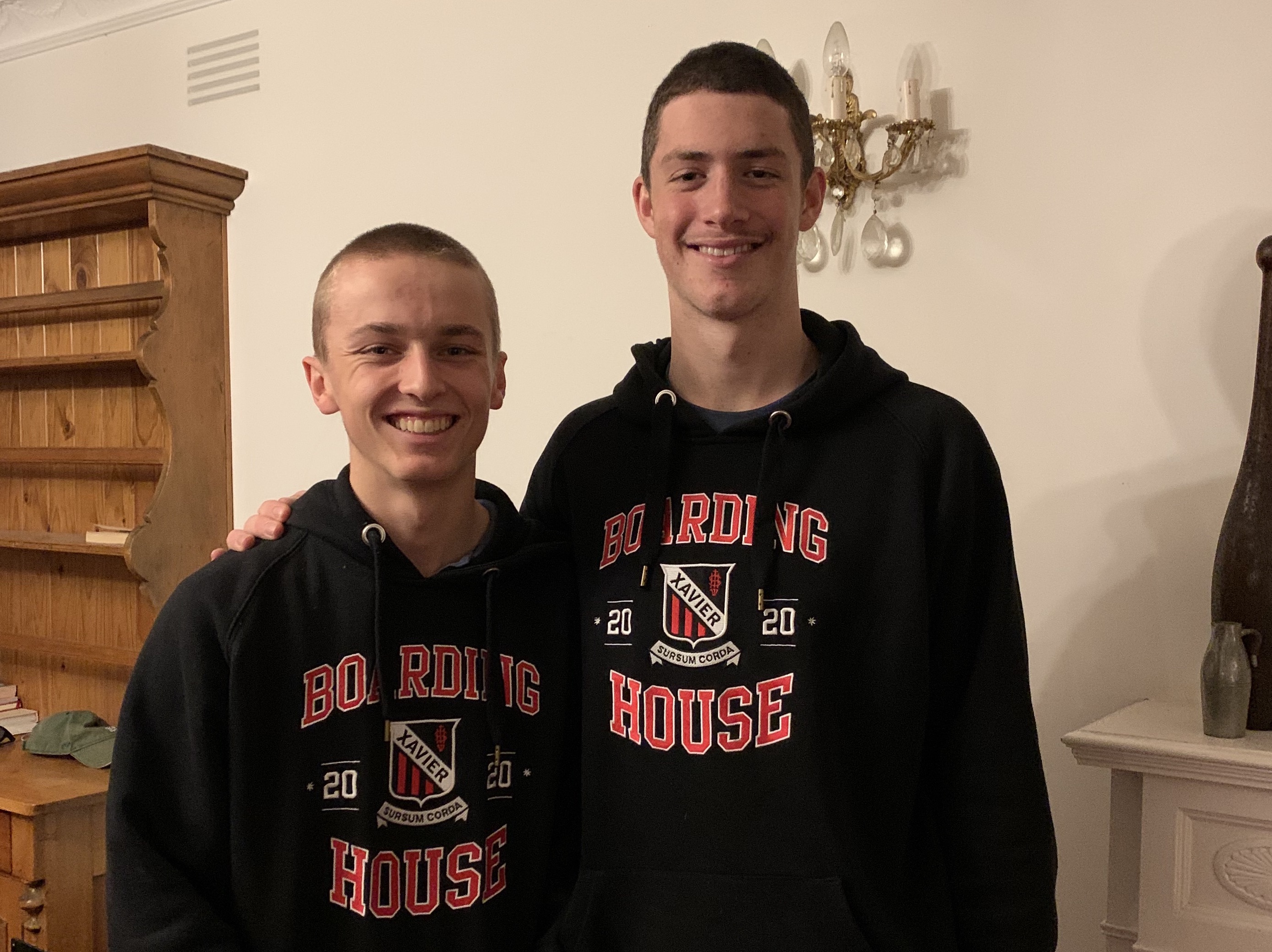 Ben and Hugh wearing their Xavier Boarding House hoodies.